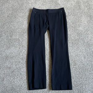 INC black stretchy pants faux pockets on front back zip pockets on back
